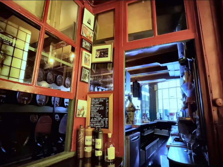 The interior of a cozy Brown cafe features a mix of vintage decor and modern touches creating a warm atmosphere